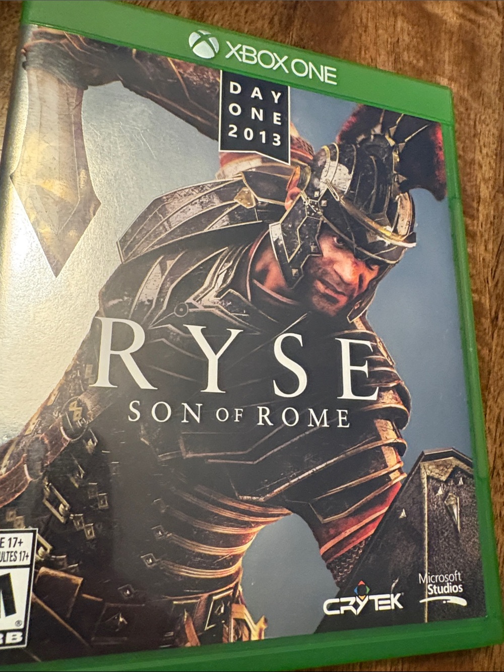 adidas green Xbox One game case with Ryse Son of Rome cover art